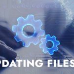 image of a person typing on their laptop with the words "Updating Files" overlaid.