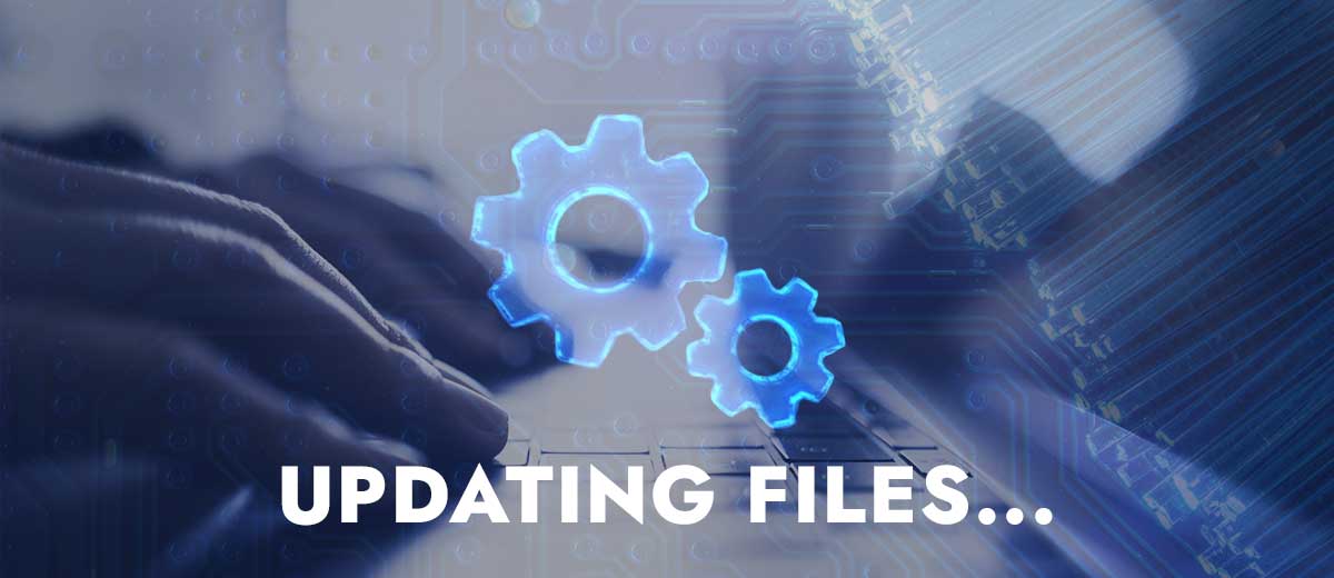 image of a person typing on their laptop with the words "Updating Files" overlaid.